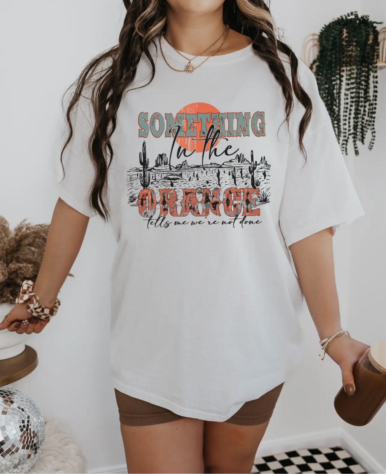 Something in the orange tee